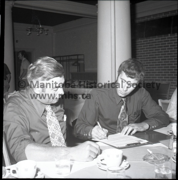 (Armstrong) Aug. 17/73 Jr. Terriers
Dale Peters Signed As New Coach of Junior Terriers
Portage Terrier president makes it official - Dale Peters of Brandon is the new coach of the Centennial Cup winners. Peters, right, had already signed this one-year contract when this photo was taken at the Portage Hotel Friday. The job starts Sept. 1. 11164a.jpg