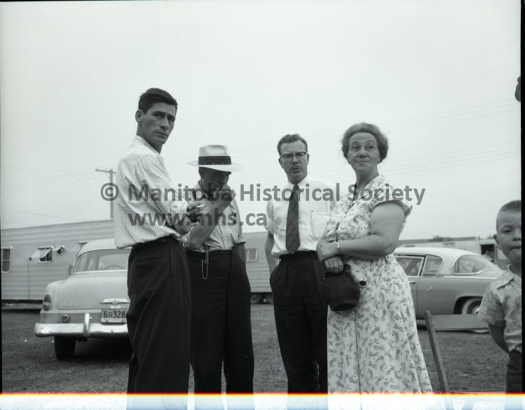 Tashiro July 11-12 1955 News PORTAGE FAIR PERSONALITIES VISITORS Mrs. Peg Longnecker, of Des Moines, producer of the variety show at the Portage Fair Grandstand, is seated between Mr. and Mrs. Clarence Hyde. Mr. Hyde is a director of the Fair Board and is president of Western Canada Fairs Association. Some of the interested spectators watching Tuesday’s harness racing program at the Portage Fair, all attired in white shirts, are shown above. The group includes Mr. and Mrs. Jack Bates, Mac Brownridge, Hon. Ron Robertson, minister of agriculture, and Frank Brydon, president of the Fair, in the first row, and in the second, Gardner Young, Hon. Charles E. Greenlay, minister of labor and of mines and resources, and Deputy Agricultural Minister Bell. Duff Roblin, leader of the Progressive Conservative party in Manitoba, took in the portage fair along with thousands of others. He is shown above with Orville Sherritt, and Mr. and Mrs. David Logan. Mr. Roblin is second from right. 11404a.jpg